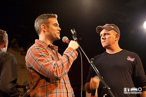 Theo Epstein and Mike O'Malley auction off items at the Hot Stov