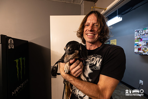Pat Beers of The Schizophonics with his dog Beanie backstage at The Observatory in San Diego