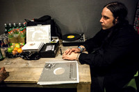 Al Cisneros listening to reggae records backstage at Roadburn