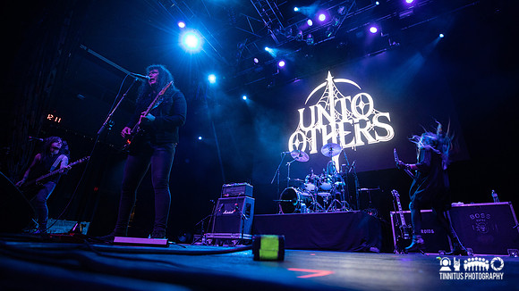 Unto Others in concert