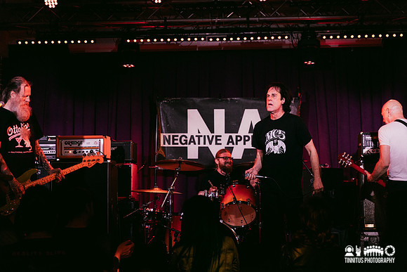 Negative Approach in concert