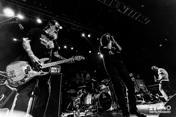 Negative Approach in concert