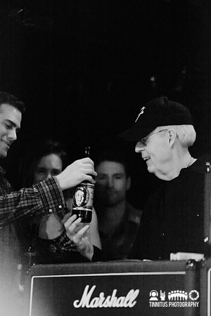 Theo Epstein admires Peter Gammons' beer label at the Hot Stove/